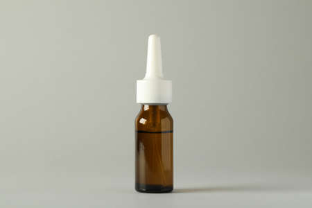 Bottle of nasal spray on light gray backgroundの写真素材