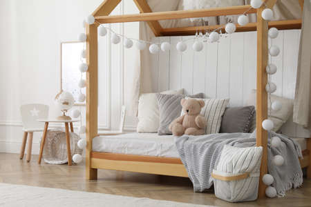 Stylish room for kid with house bed. Interior designの写真素材