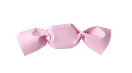Delicious candy in light pink wrapper isolated on white