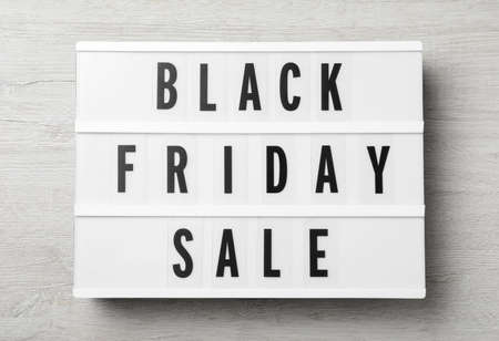 Lightbox with words Black Friday Sale on wooden table, top viewの写真素材