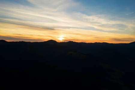 Silhouette of mountain landscape at sunset. Drone photographyの写真素材