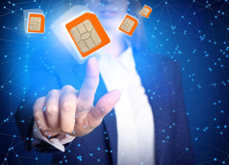 Woman demonstrating SIM cards of different sizes on color background, closeup
