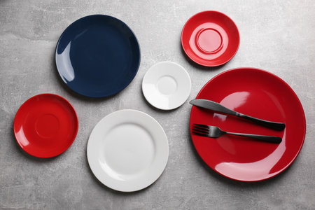 Flat lay composition with beautiful dishware on gray table
