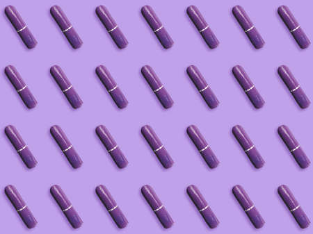 Many tampons on violet background, flat layの写真素材