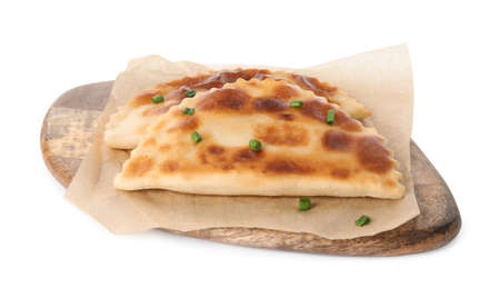 Board with delicious fried chebureki isolated on white
