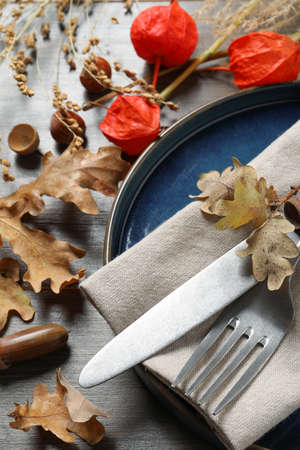 Festive table setting with autumn decor on wooden background, closeupの写真素材