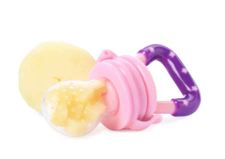 Nibbler with boiled potato on white background. Baby feeder