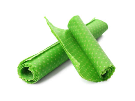 Rolled beeswax food wraps on white background
