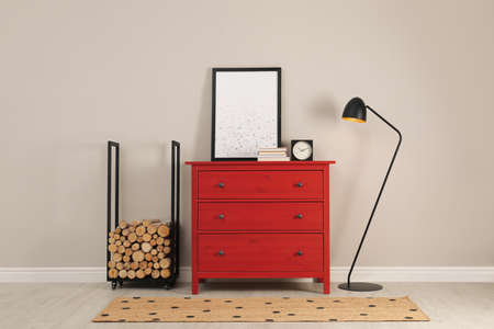Modern room interior with chest of drawers near light wallの写真素材