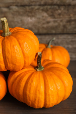 Fresh ripe pumpkins on wooden table, closeupの写真素材