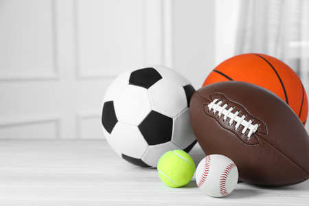 Set of different sport balls on white wooden table indoors. Space for textの写真素材
