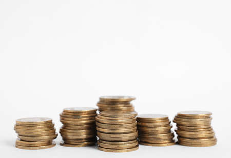 Many Euro coins stacked on white backgroundの写真素材