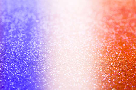 4th of July - USA Independence Day. Blurred view of glitters in colors of American national flag,...