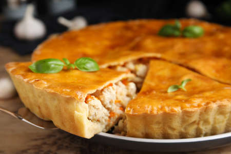 Delicious meat pie with basil on table, closeupの写真素材