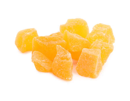 Delicious orange candied fruit pieces on white backgroundの写真素材