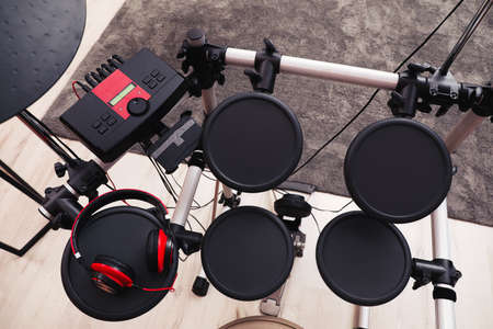 Modern electronic drum kit with headphones indoors, above view. Musical instrumentの写真素材