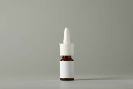 Bottle of nasal spray on light gray backgroundの写真素材