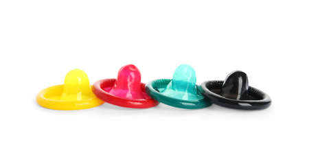 Unpacked colorful condoms on white background. Safe sexの写真素材
