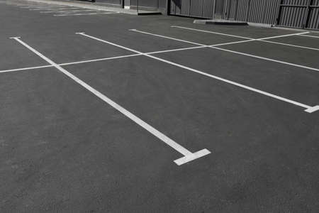 Car parking lot with white marking outdoors