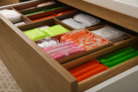 Storage of different feminine hygiene products in wooden drawer, closeupの写真素材