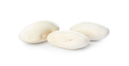 Three uncooked navy beans on white backgroundの写真素材