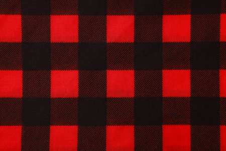 Top view of red bandana with check pattern as background