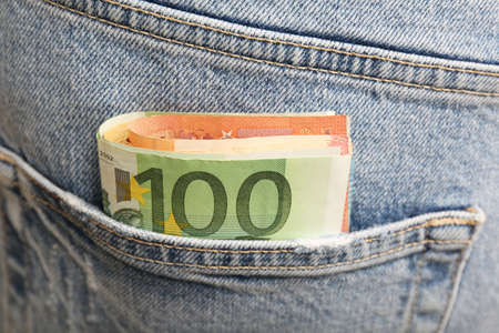 Euro banknotes in pocket of jeans, closeup. Spending moneyの写真素材