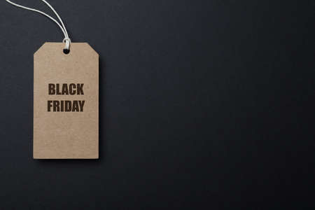 Tag with words Black Friday on dark background, top view. Space for textの写真素材