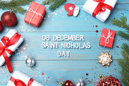 Text 6 December Saint Nicholas Day and festive decor on turquoise wooden table, flat lay