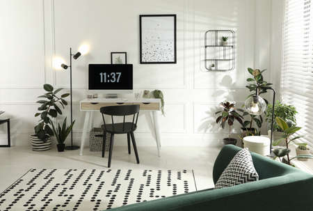Stylish room interior with comfortable workplace. Home office