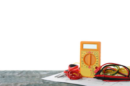 Set of electrician's tools and accessories on wooden table against white background. Space for textの写真素材