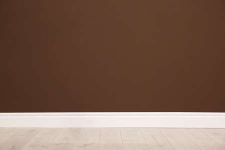 Empty room with wooden floor and brown wall. Interior designの写真素材
