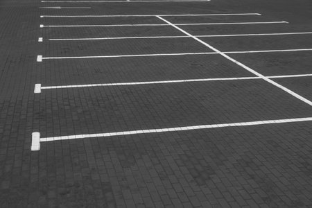 Empty car parking lots with white marking lines outdoorsの写真素材