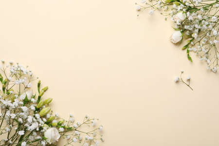 Beautiful floral composition with gypsophila on beige background, flat lay. Space for textの写真素材