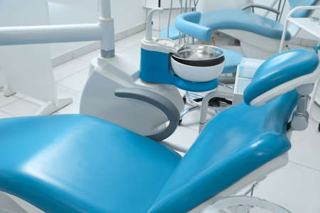 Dentist's office interior with chair and modern equipmentの写真素材