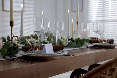 Festive table setting with beautiful tableware and decor indoors