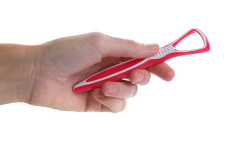 Woman holding tongue cleaner for oral care on white background, closeup