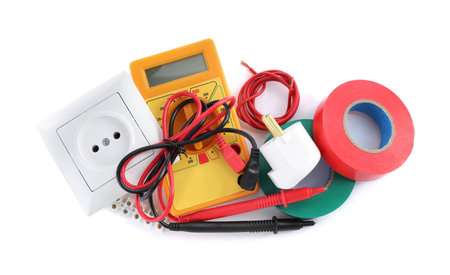 Set of electrician's accessories on white background, top view