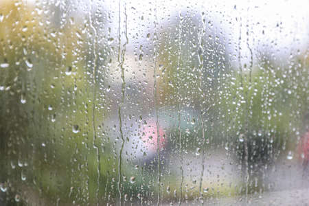 Window glass with water drops, closeup. Rainy weatherの写真素材