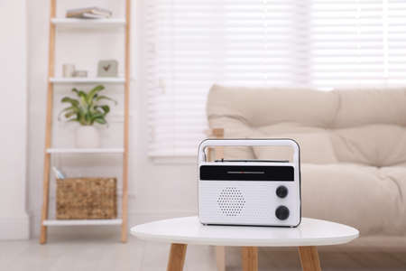 Stylish white radio on table indoors. Space for textの写真素材