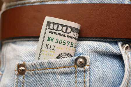 Dollar banknote in pocket of jeans, closeup. Spending moneyの写真素材