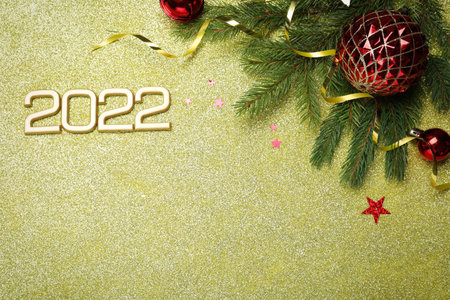 Flat lay composition with number 2022 and festive decor on shiny background, space for text. Happy...
