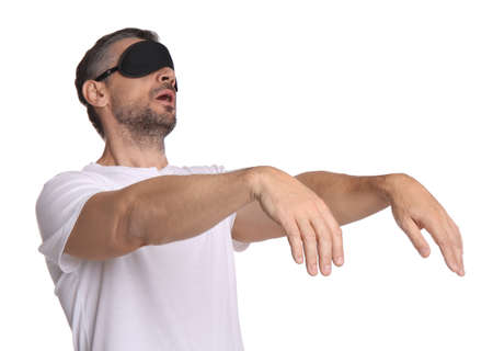 Man with eye mask in sleepwalking state on white backgroundの写真素材