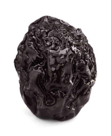 One sweet dried prune isolated on whiteの写真素材