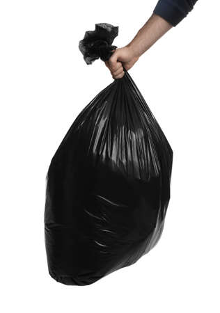 Man holding trash bag filled with garbage on white background, closeupの写真素材