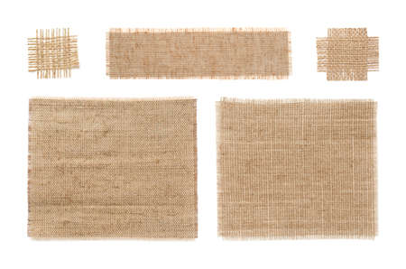 Set with pieces of natural burlap fabric on white background, top viewの写真素材