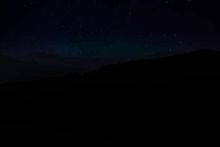 Beautiful view of starry sky over mountains at night