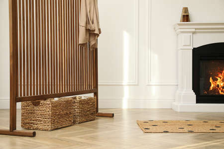 Stylish room with folding screen and fireplace. Interior designの写真素材