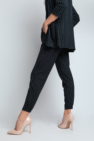 Woman in formal suit on light background, closeup. Business attireの写真素材