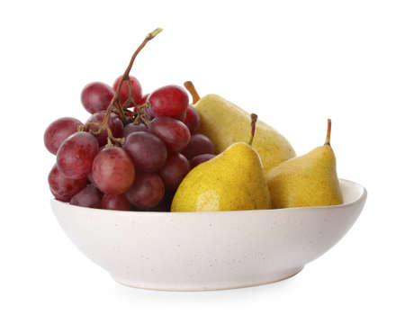 Fresh ripe pears and grapes in bowl on white backgroundの写真素材